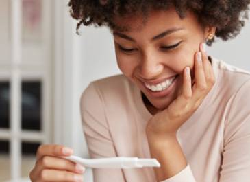 Women taking pregnancy test