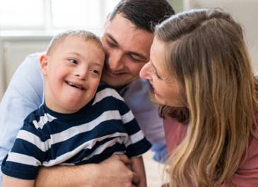 Mom, dad and little boy with special needs