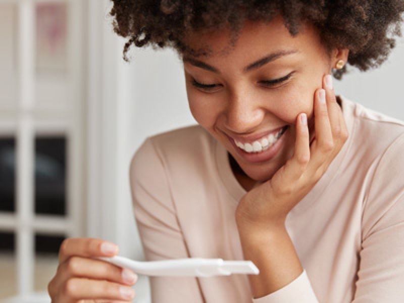Women taking pregnancy test