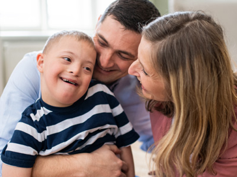 Mom, dad and little boy with special needs