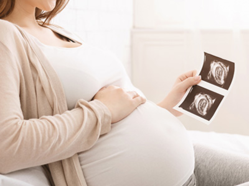 Women hold baby ultra sound